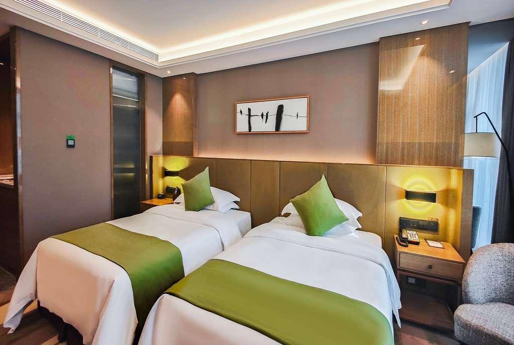 Leshan Ramada Hotel Habitación foto